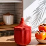 Red decorative container with cashmere persimmon candle