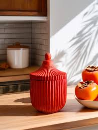 Red decorative container with cashmere persimmon candle