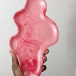 Abstract pink tray held by hand