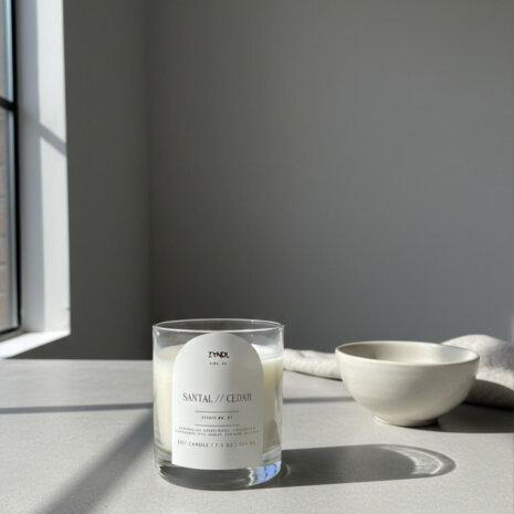 cedar scented candle cedar scented candle and bowl on minimalist table