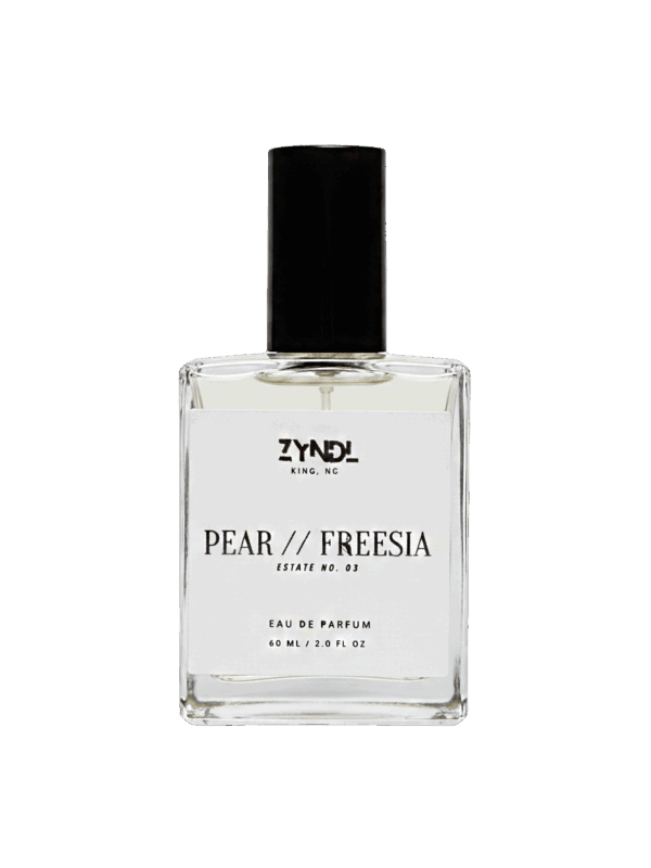 Bottle of pear and freesia perfume