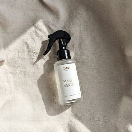 mango and coconut milk room spray mango and coconut milk room spray bottle on a light fabric