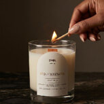 Hand lighting scented Oud Candle on marble