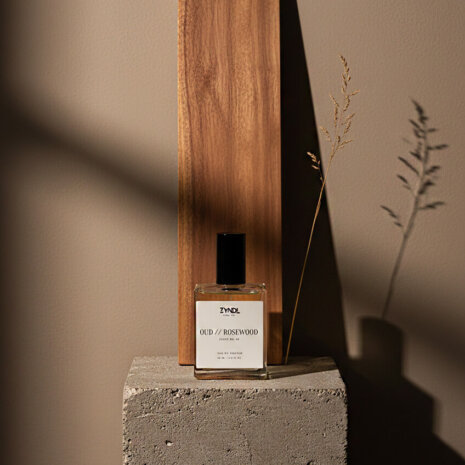 oud de toilette oud de toilette bottle with wood backdrop