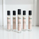 Five rollerball perfume bottles displayed. rollerball perfume