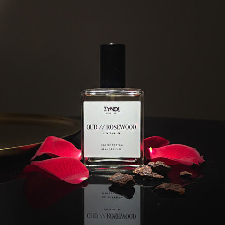 rosewood perfume rosewood perfume bottle with rose petals.