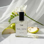 Bottle of pear and freesia perfume