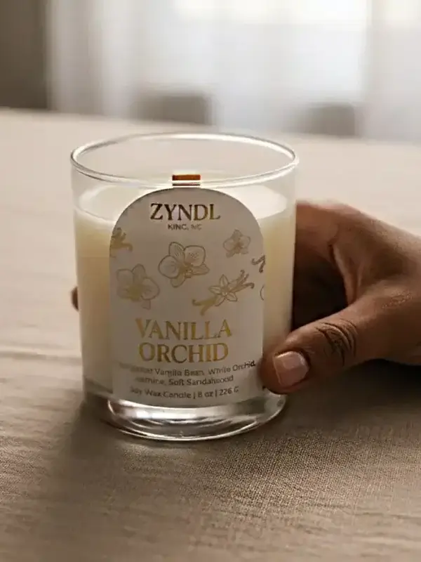 vanilla scented orchid candle Hand holding vanilla orchid candle