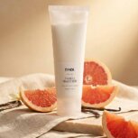 Grapefruit lotion with fresh citrus and vanilla ingredients lifestyle scene