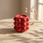 Dragon's Blood scented candle being lit by hand — coconut wax, wood wick, handmade in King NC